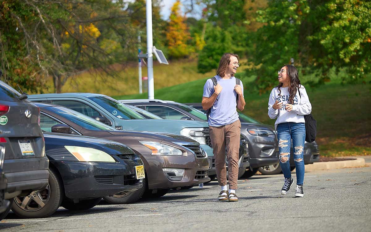 students walking in the parking lot