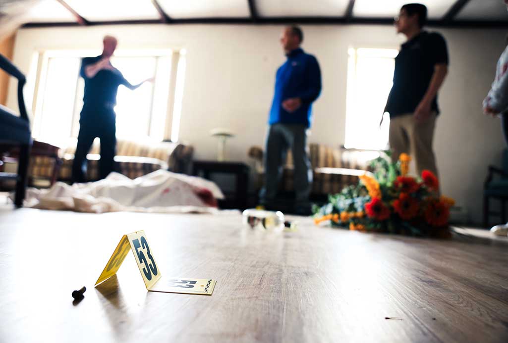 a mock criminal investigation inside the crime scene house