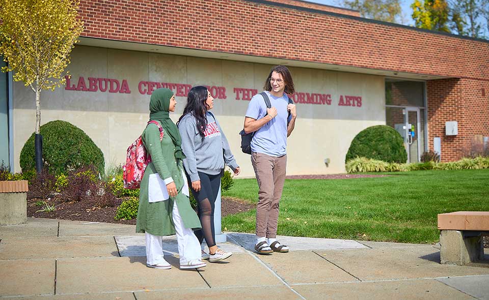 students walking in front of labuda center