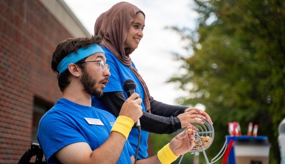 two students calling bingo at orientation