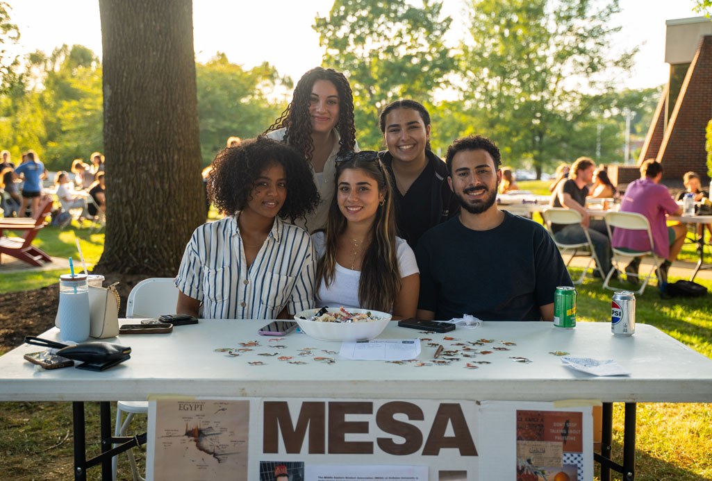 group of students sitting at their DSO table at a Student Organizations Fair