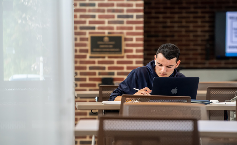 student working on a computer