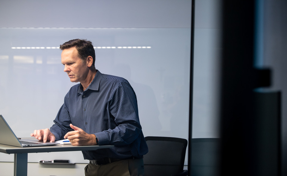 man looking at a computer