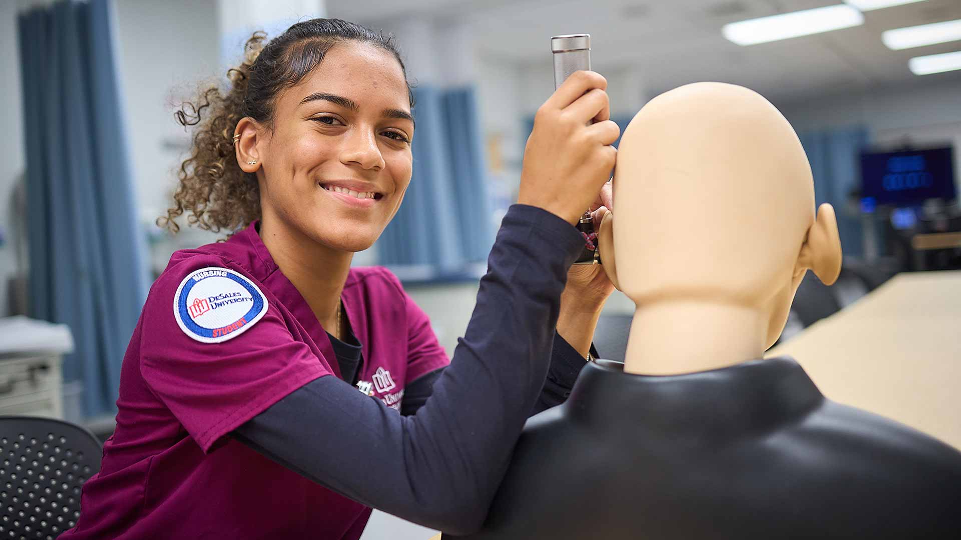nursing student training in a lab