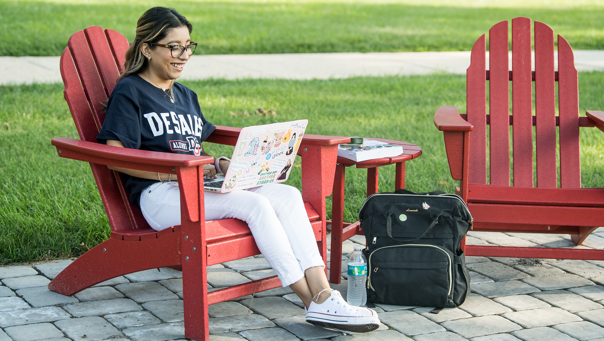 student working on laptop outdoors