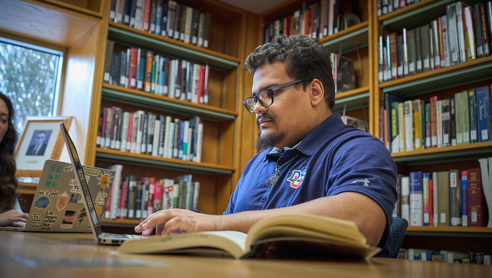 student looking at a laptop