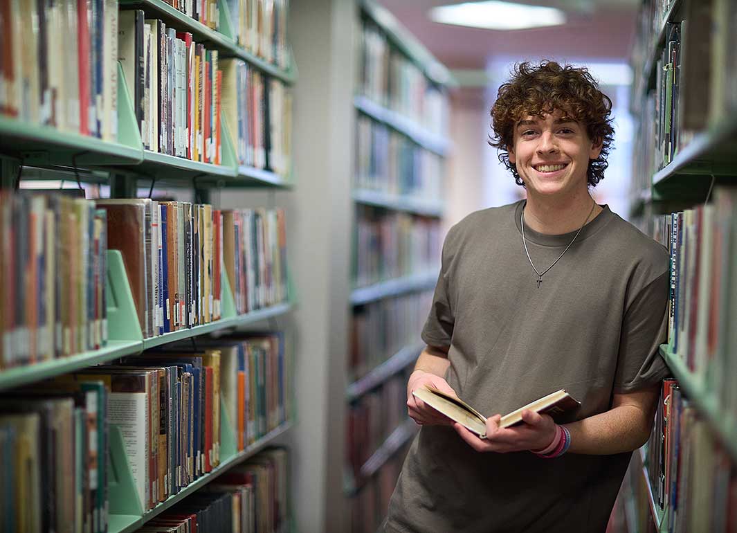 student in library