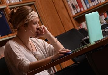 girl studying on a laptop