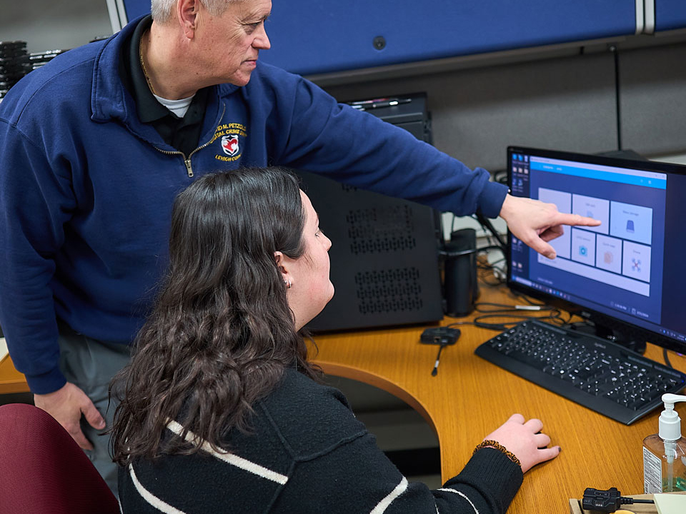 student looking at a computer