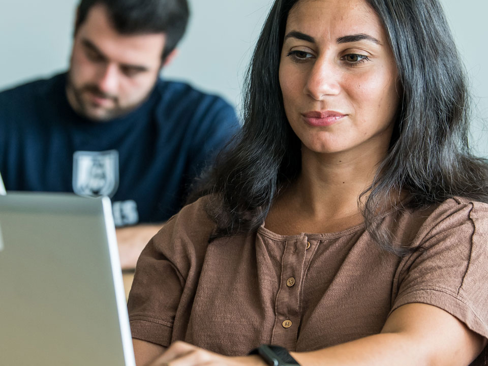 girl looking at a laptop