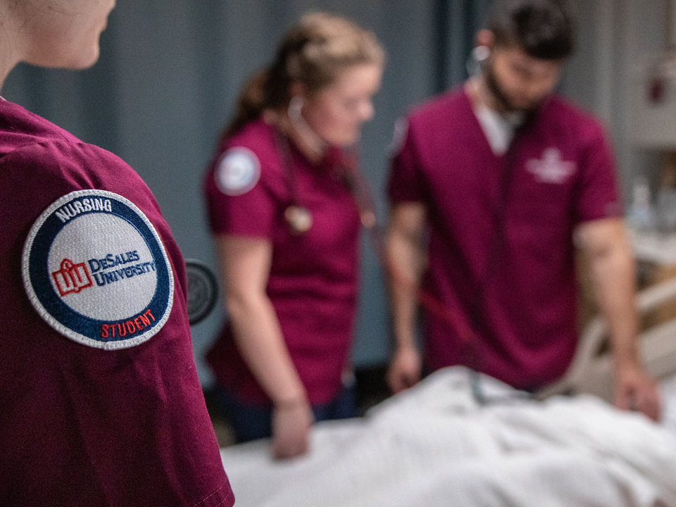 student nurses tending to a patient