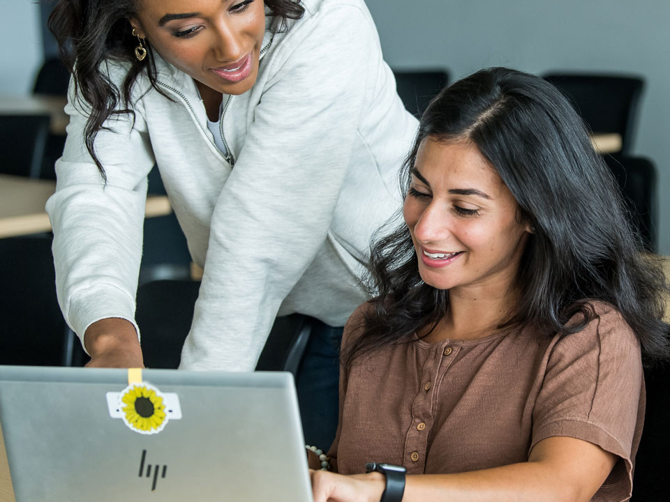 students looking at computer