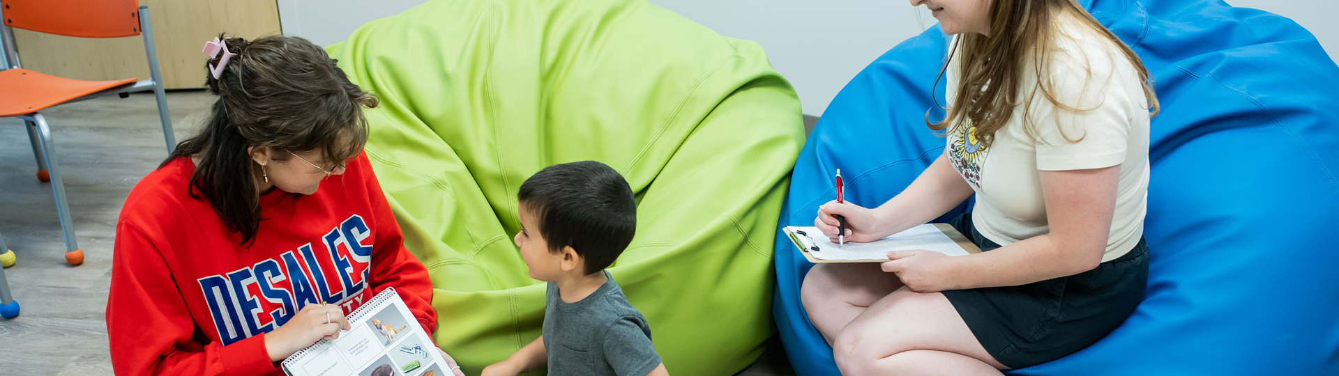 Girl reading to a child