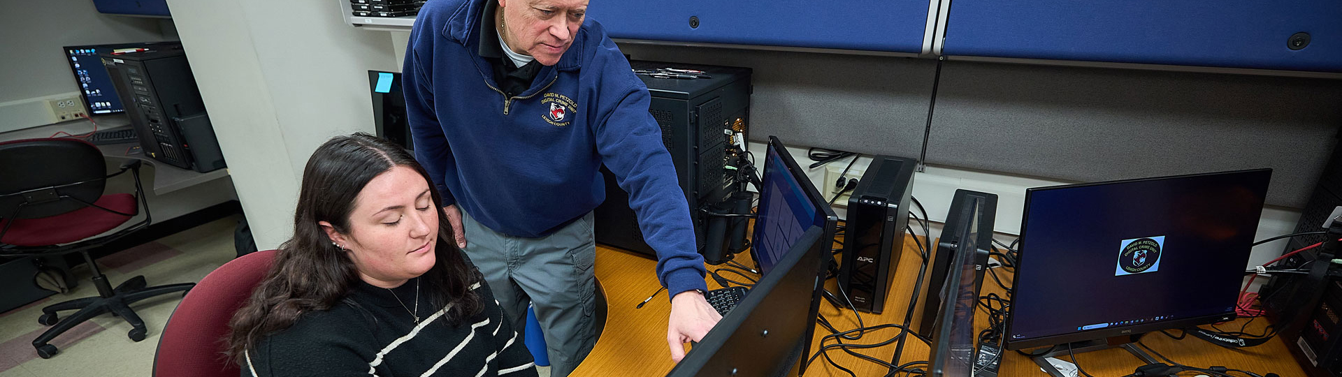 Two people working on a computer