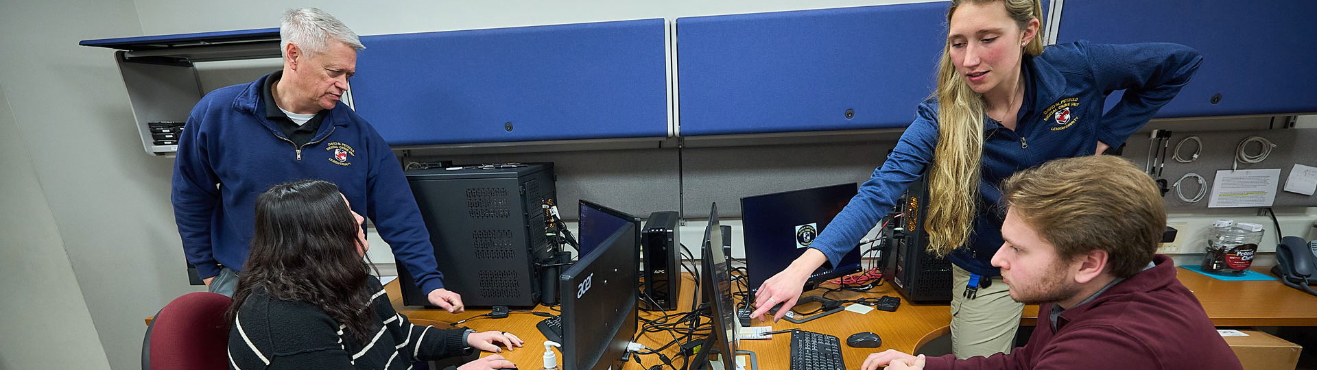 Two people looking at a computer screen