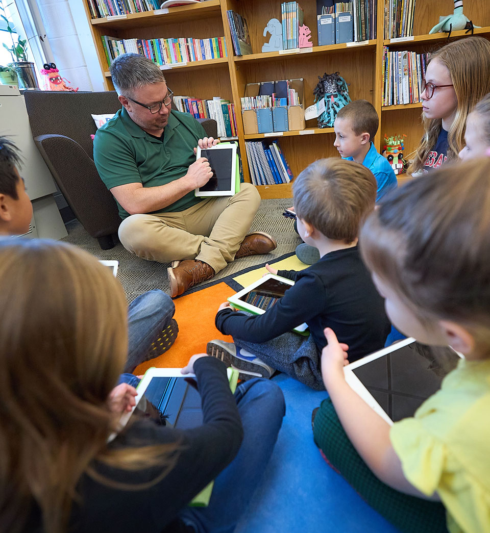 children listening to a teacher