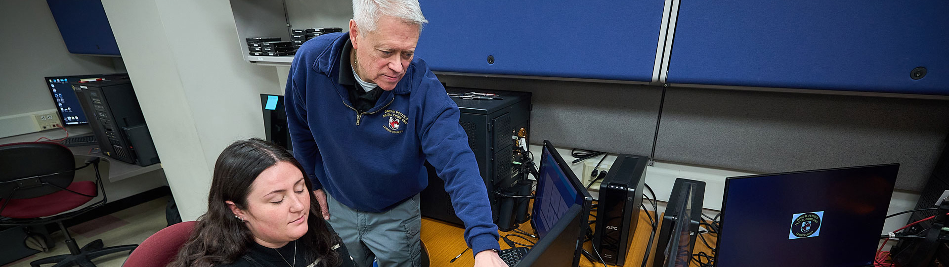 Two people working on a computer