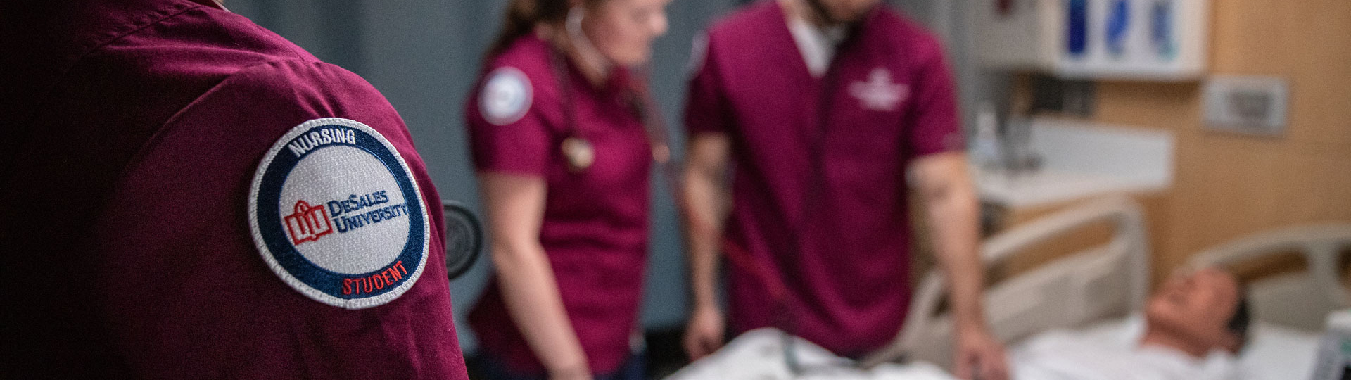 Student nurses checking up on a patient