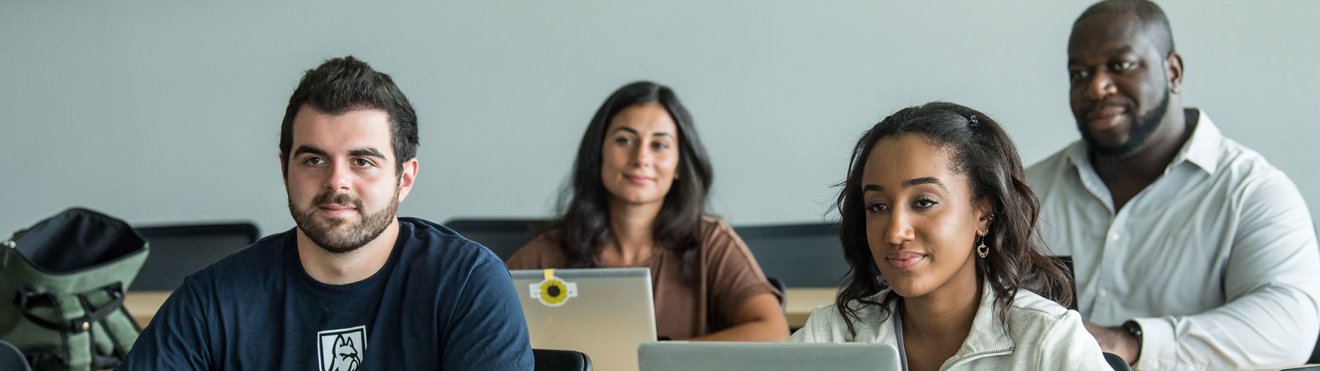 Students in a classroom taking notes