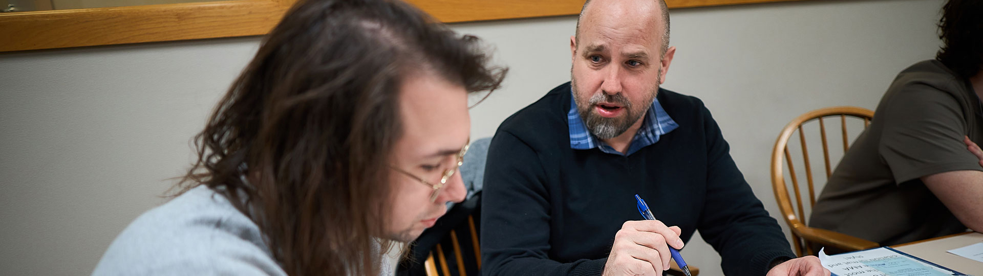 Teacher helping a student