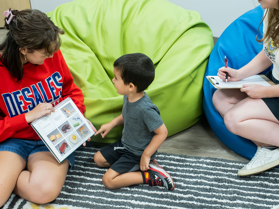 small boy receiving speech therapy