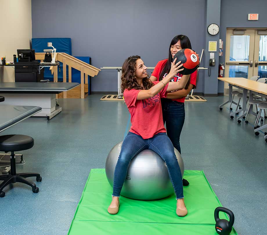 students training physical therapy techniques