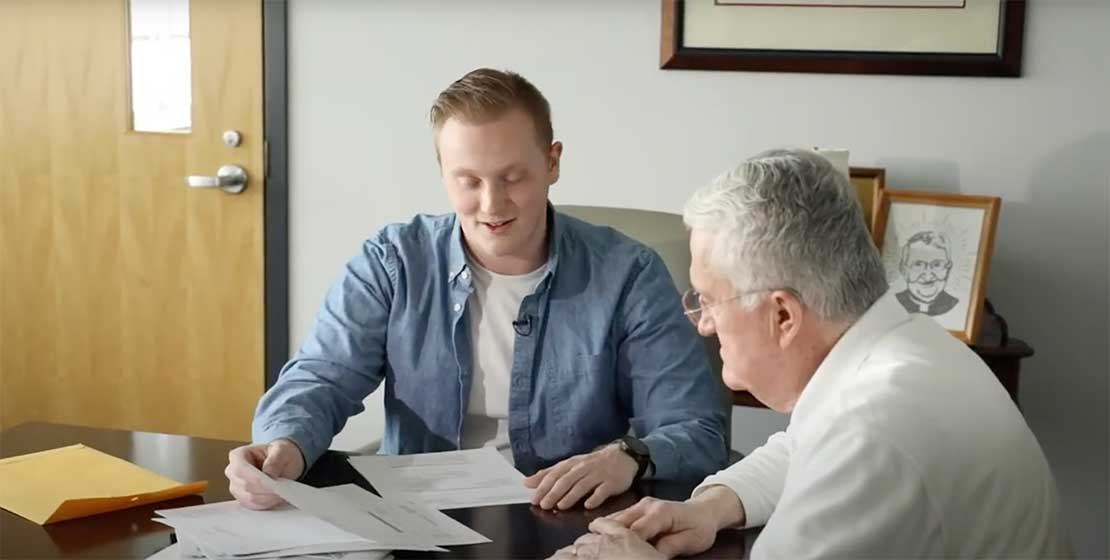 student preparing taxes for an older man