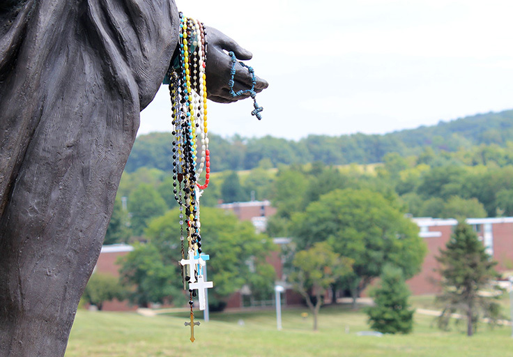 rosaries at the Mary statue