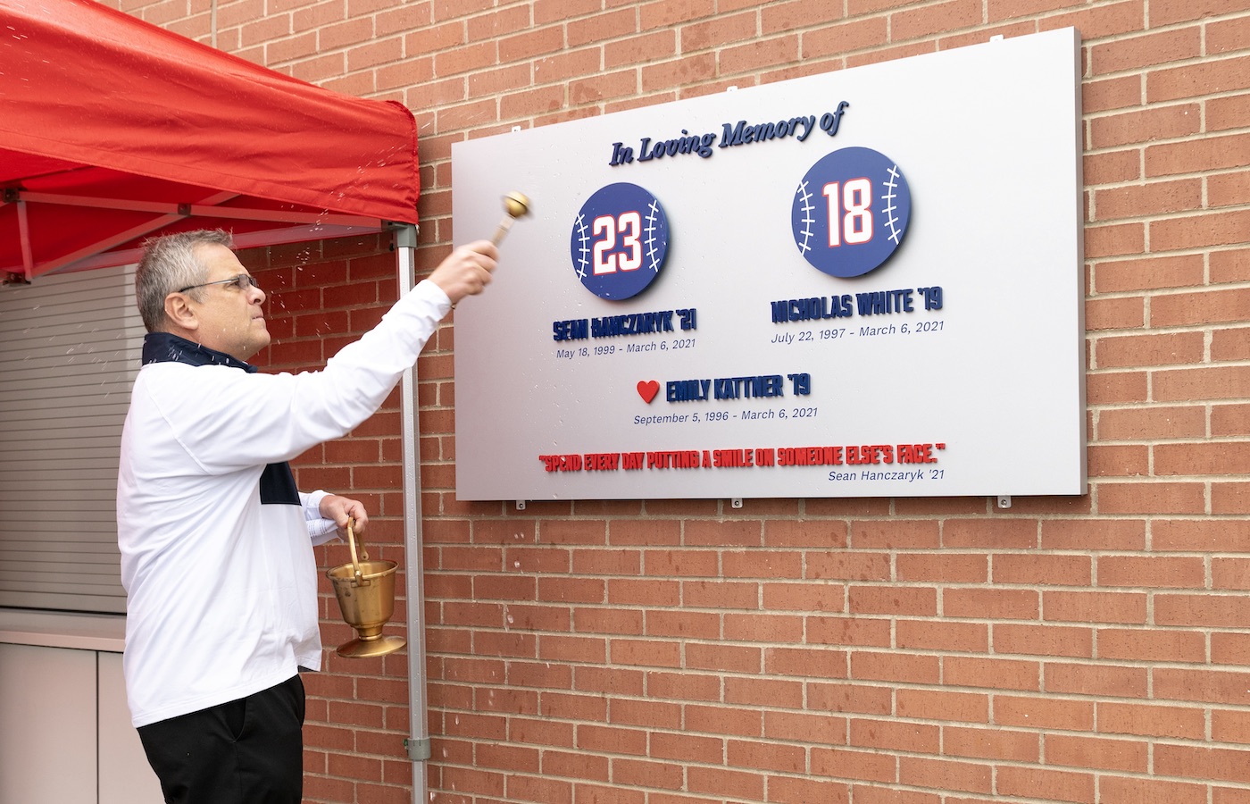 Father Kevin Nadolski blessing memorial baseball plaque