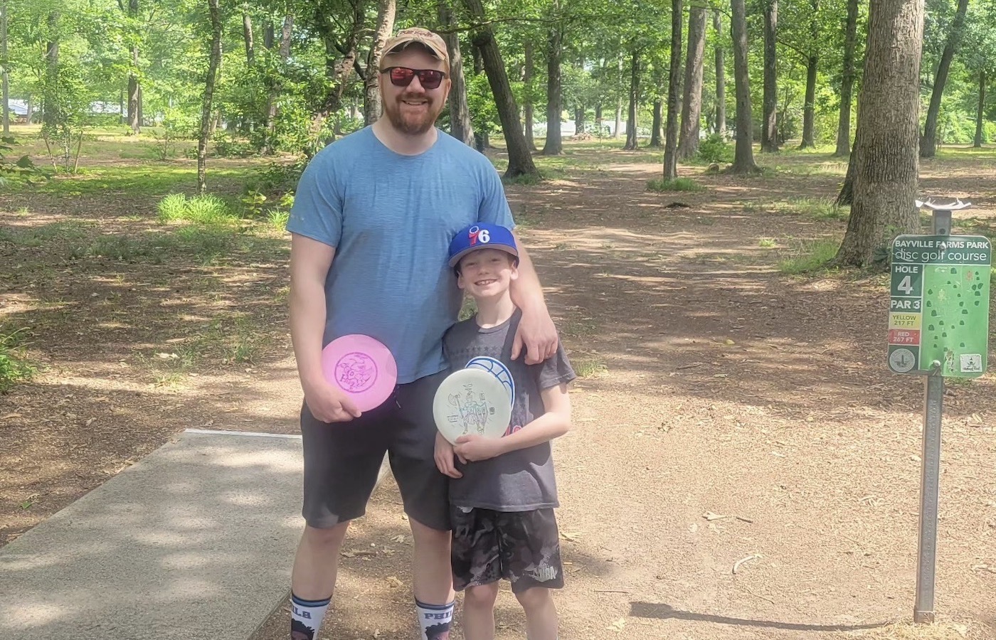 Jeff Richter with his son playing disc golf