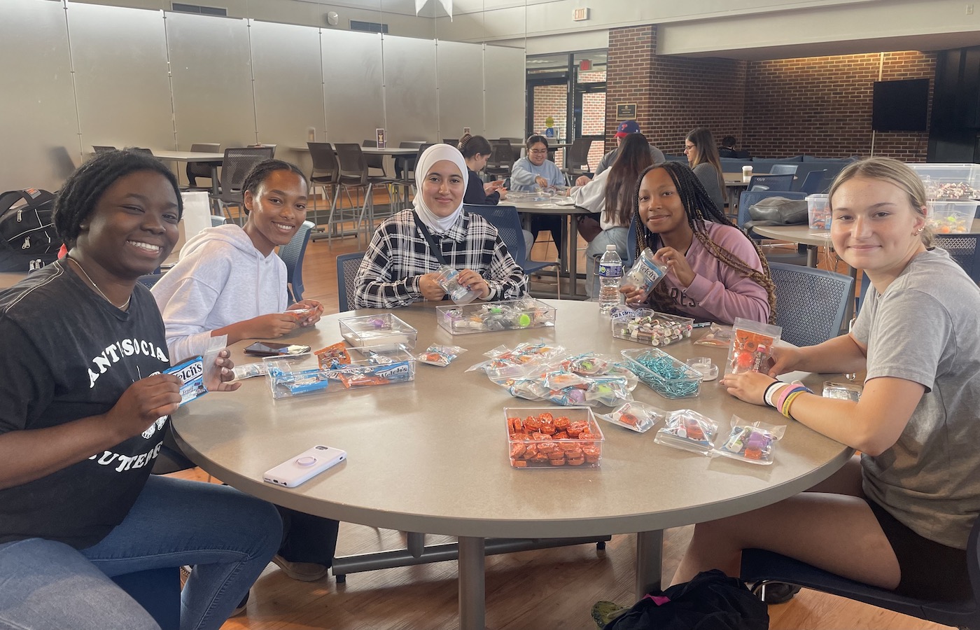 Students making treat bags