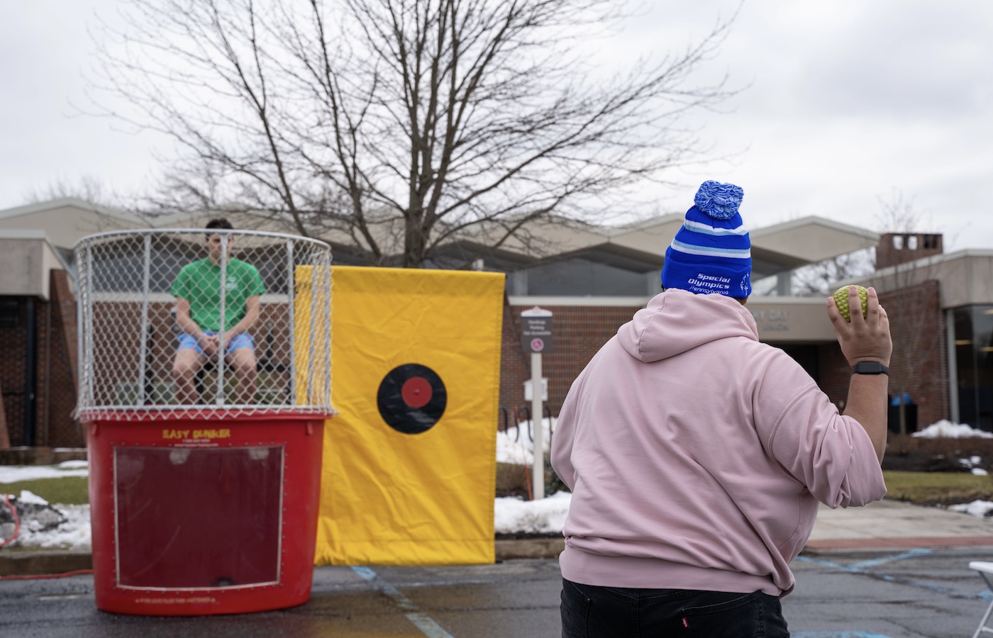 Student throwing a ball to dunk someone